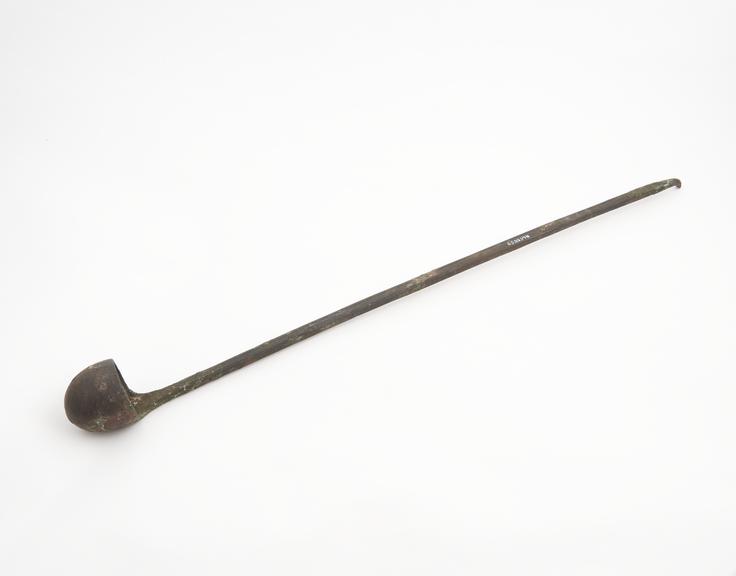 Small metal ladle with deep bowl and long handle