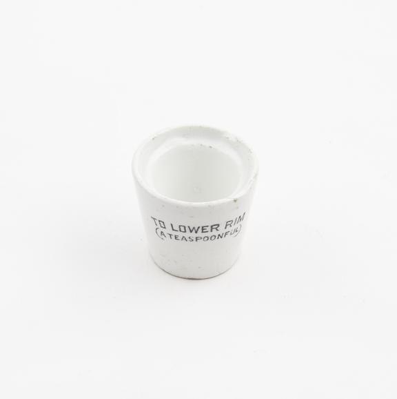 Earthenware measure, glazed, introduced by W