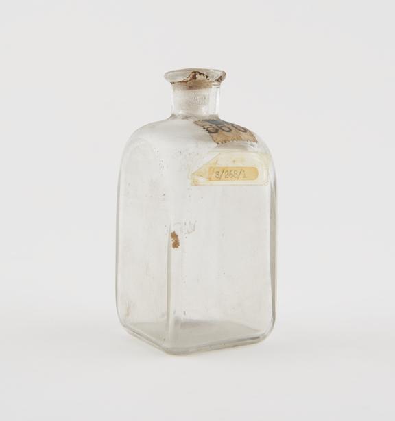 Square medicine bottle, clear glass, early 19th century