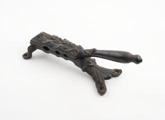 Metal hinder cork presser with leaf decoration