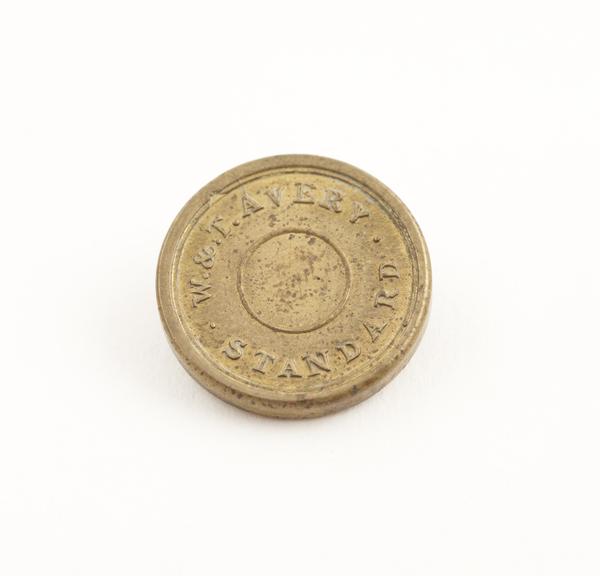 Circular brass half sovereign weight, made by W. and T