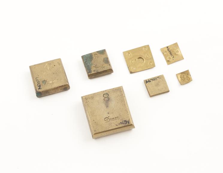 Set of square brass weights, 4 to weigh drams and 3 for grains