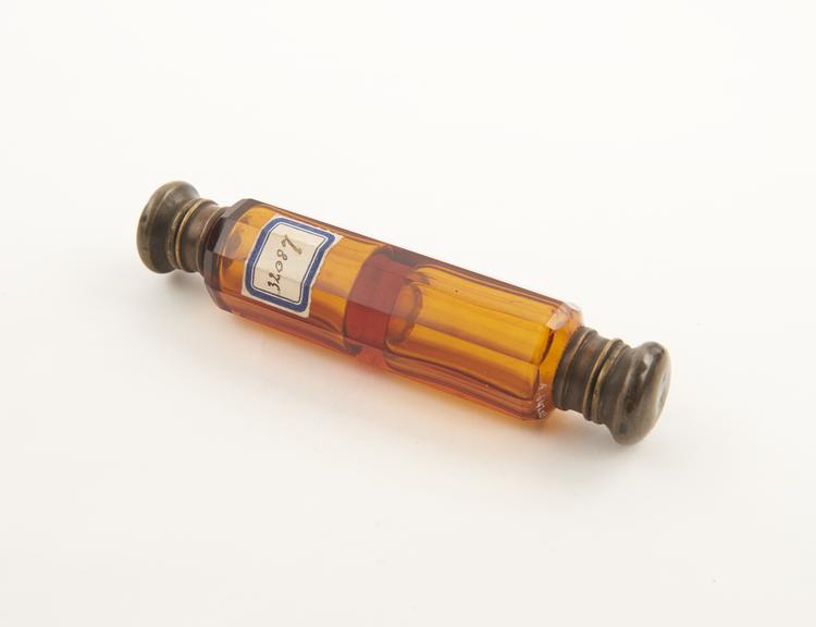 Glass perfume bottle and vinaigrette, amber coloured