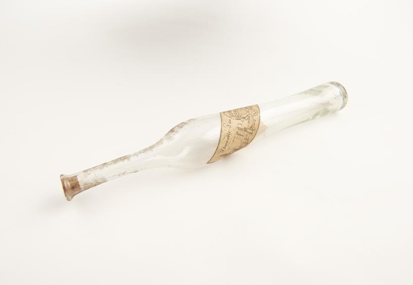 Tall eau de cologne bottle, clear glass, probably French