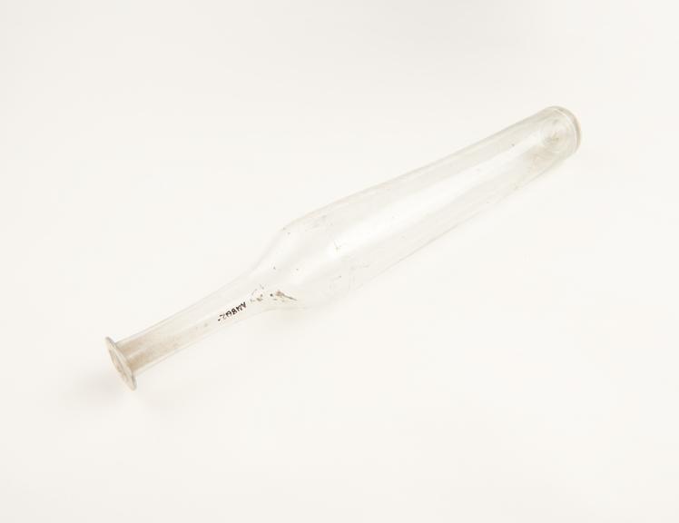 Tall eau de cologne bottle, clear glass, possibly Spanish