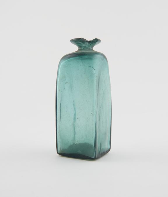 Dark green glass bottle, rectangular, square in section