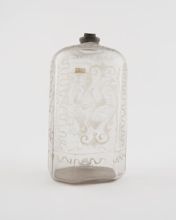 Clear glass bottle with engraved decoration, possibly Swiss