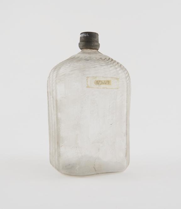 Octagonal storage bottle, clear glass, empty, possibly Swiss