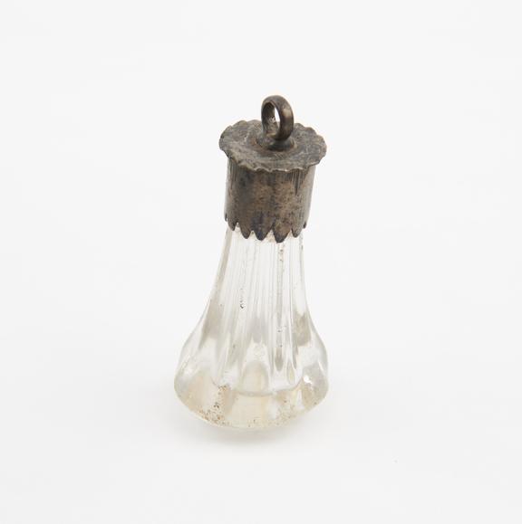 Glass object, possibly an amulet, conical