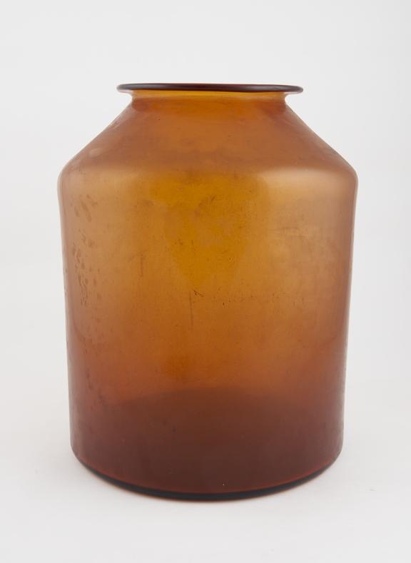 Large brown glass storage bottle