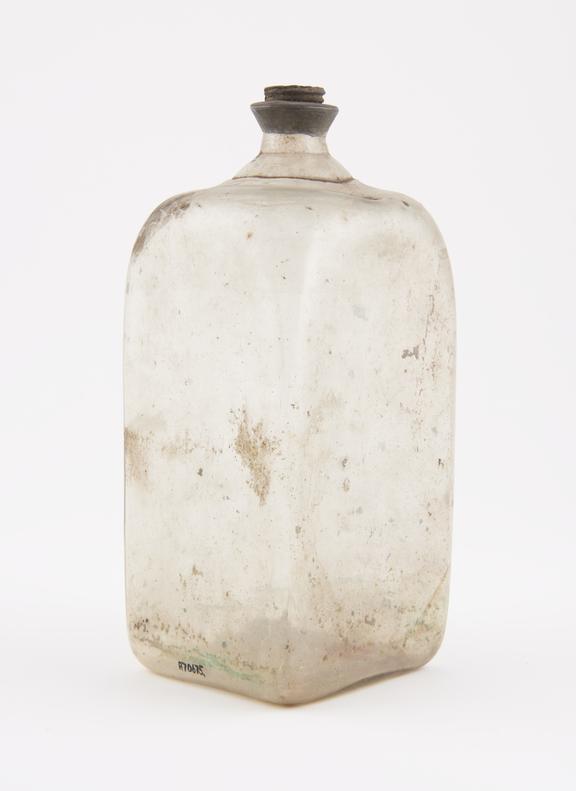 Square storage bottle, clear glass, empty, probably Swiss