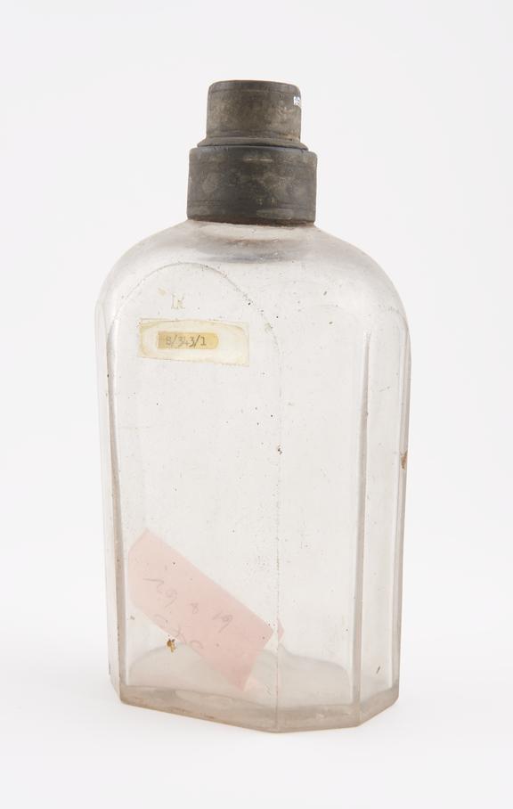 Octagonal storage bottle, clear glass, empty, probably English