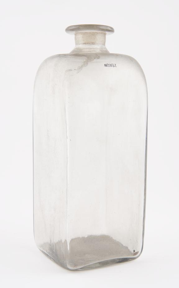Square storage bottle, clear glass, empty, possibly English