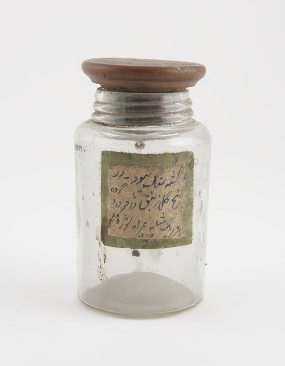 Glass dispensing bottle, used for unidentified drug, by H. A