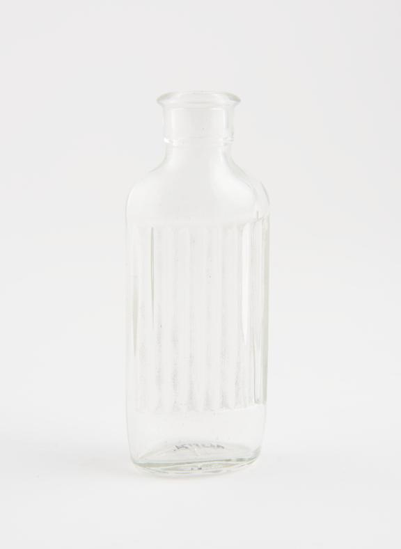 Dispensing bottle, clear glass, empty, unlabelled