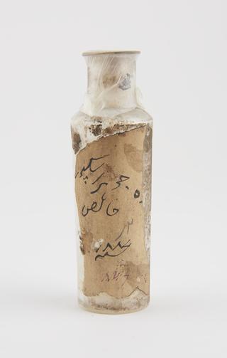 Dispensing bottle,  labelled in Arabic script, empty
