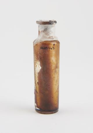 Dispensing bottle, with brown resinous deposit