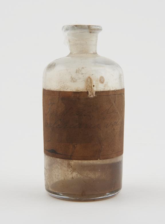 Cylindrical clear glass bottle with pontil mark