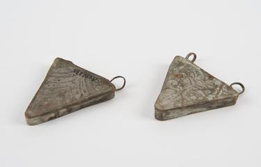 Two silver-plated amulets