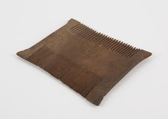 Wooden comb with two sets of teeth
