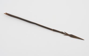 Steel arrowhead with part of wooden shaft