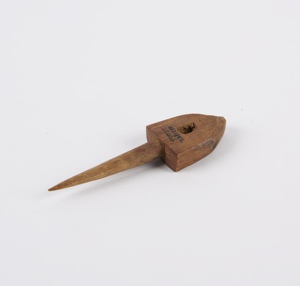 Carved wooden peg