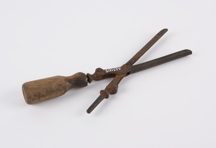 Iron tongs with wooden handle