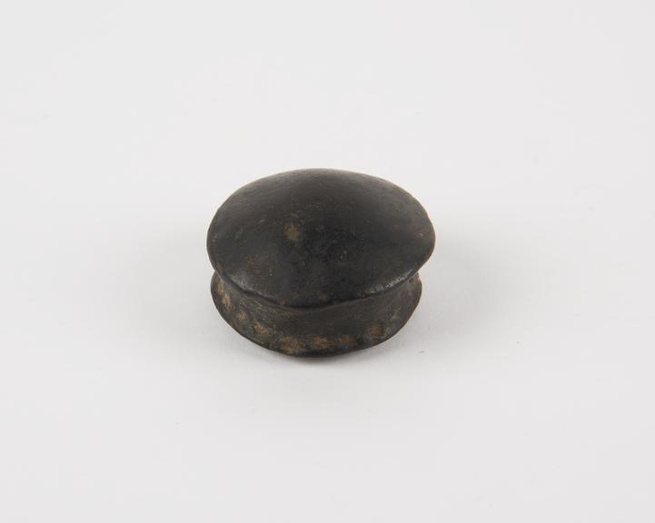 Pottery lip plug with convex top, African, 1880-1920