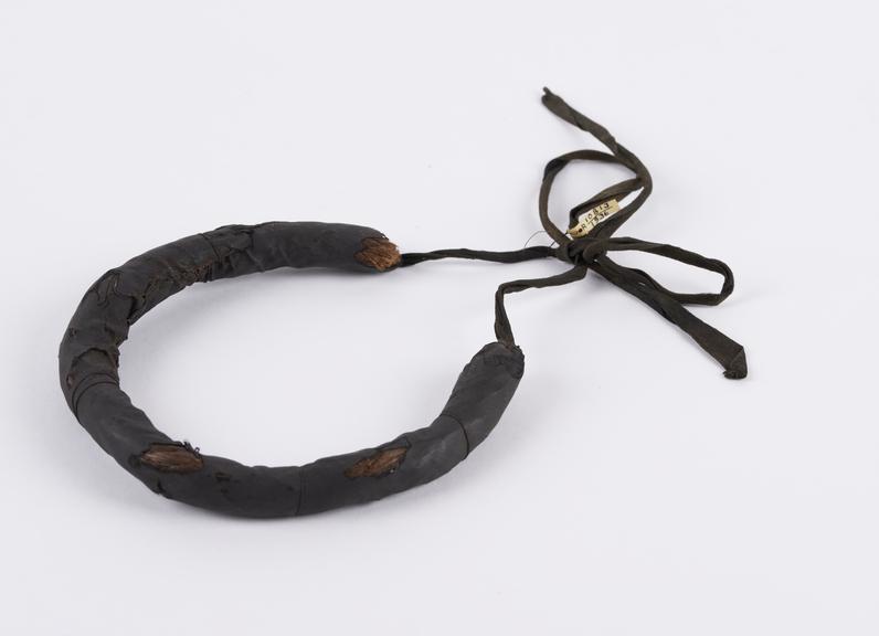 Cord or string fibre necklet bound in thin black silk