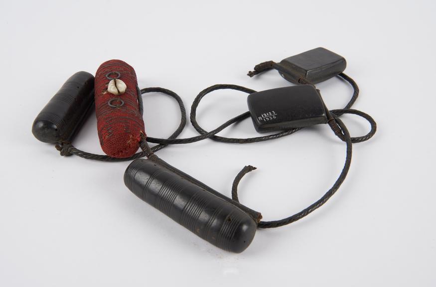 Girdle carrying five amuletic cases for protection from bullets