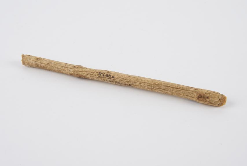 Wooden tooth brush, consisting of a stick frayed at each end