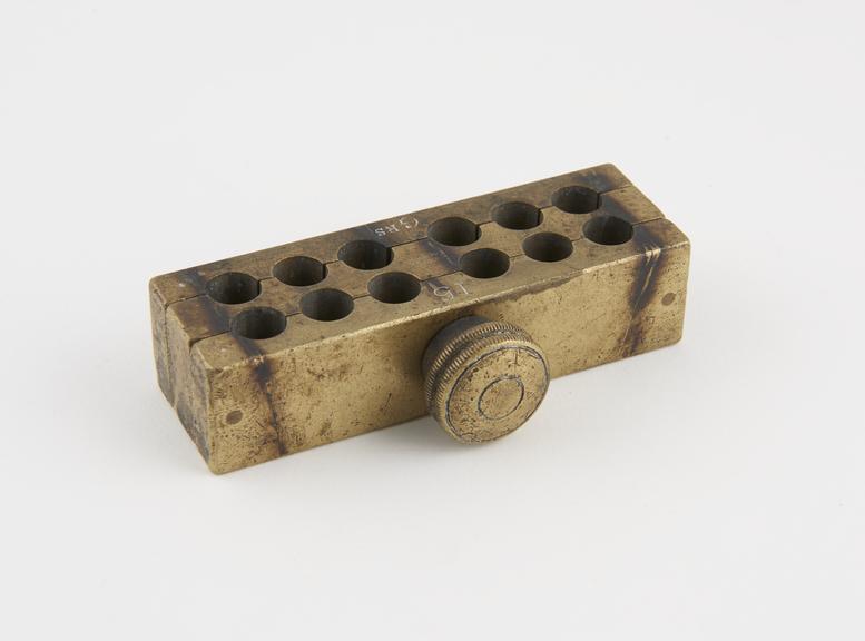 Brass pessary mould, by Maw, London