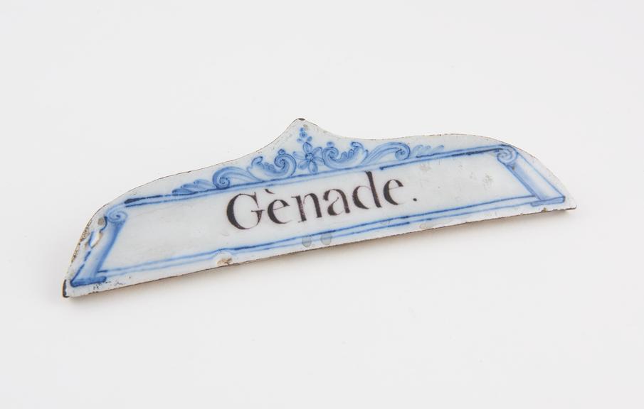 Tin glazed earthenware drawer label, inscribed Genade'