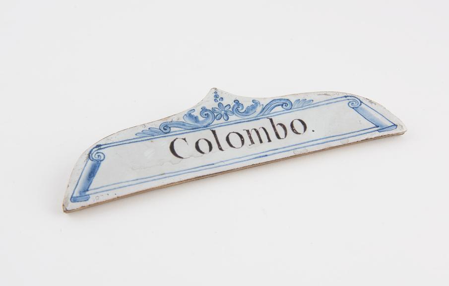 Tin glazed earthenware drawer labels, inscribed Colombo'