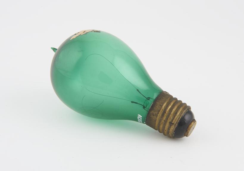 Green glass carbon filament lamp with a screw fitting with a