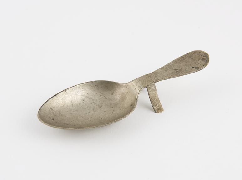 Metal medicine spoon, by S. Maw, Son and Sons, Engish, 1901-1950