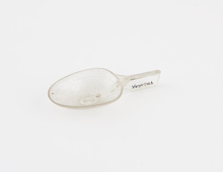 Plastic medicine spoon, graduated, by Pfizer, European