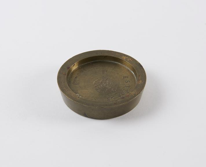 One of three Indian circular saucer shape weights  from a set