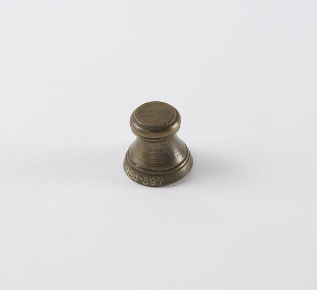 One of eight Indian brass weights, stool shaped