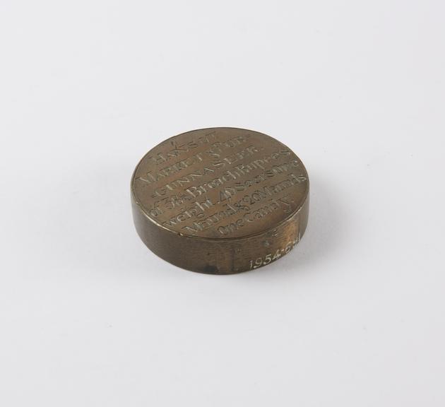 One of eleven Indian weights, all brass flat circular