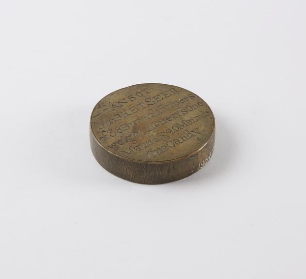 One of eleven Indian weights, all brass flat circular