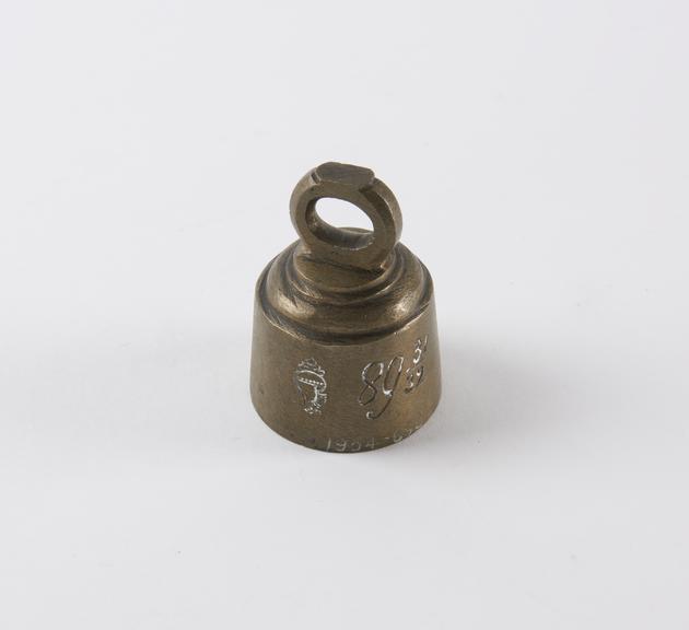 One of six Indian brass weights with lifting ring fixed at top