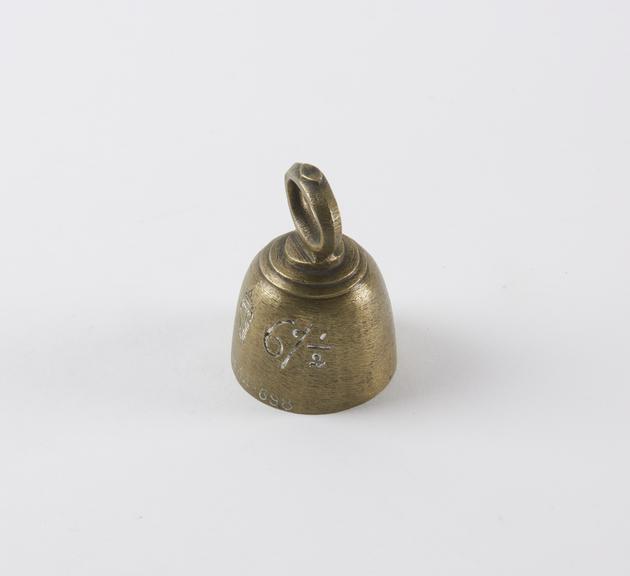 One of six Indian brass weights with lifting ring fixed at top