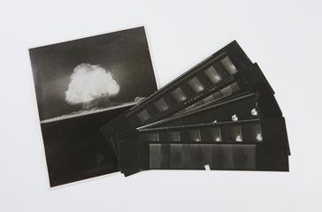 Six strips of cinema film showing the test atomic