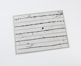 Black and white photographic print of atom track