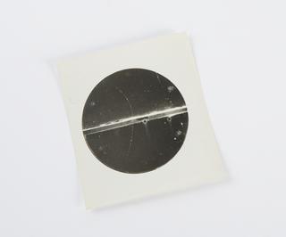 Photographic print, enlarged copy, showing a 63 million volt positron passing through a 6 mm. lead plate and emerging as a 23 million volt positron