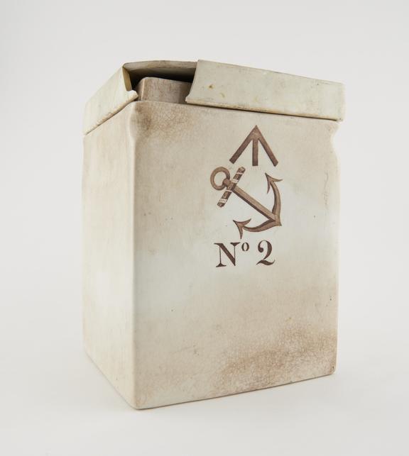 Square glazed white earthenware jar with dseparate broken lid