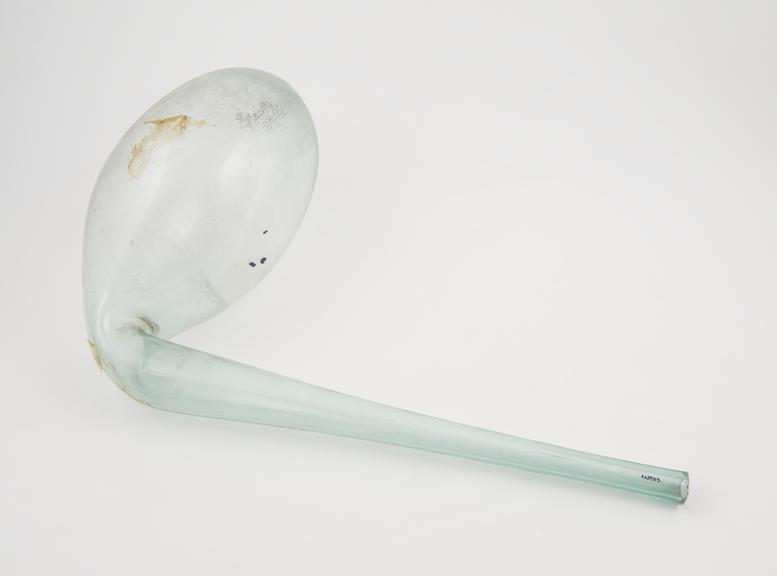 Pale green glass retort, swan necked, large oval flask