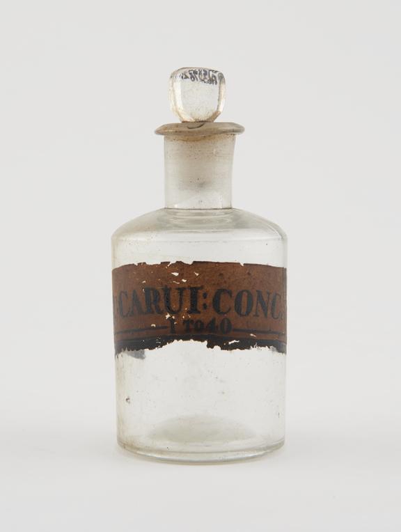 Bottle, clear glass, empty, for concentrated caraway water