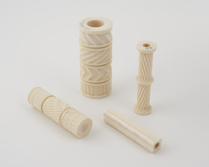 Ornamental turned cylinder of ivory decorated with four